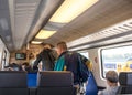 People leaving exiting a modern railway train carriage Royalty Free Stock Photo