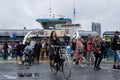 People leaving a GVB ferryboat in Amsterdam