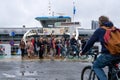 People leaving a GVB ferryboat in Amsterdam