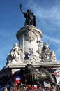 People left memorial items around the statue of Palace de la Republique