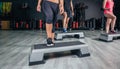 People legs over steppers training in aerobic Royalty Free Stock Photo