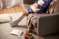 woman in socks with pillow and books at home Royalty Free Stock Photo