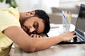 Indian man sleeping on table with laptop at home Royalty Free Stock Photo