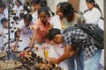 People light candles at the Buddhist temple during Vesak religious celebration in Colombo, Sri Lanka.