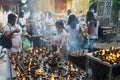 People light candles at the Buddhist temple during Vesak religious celebration in Colombo, Sri Lanka. Royalty Free Stock Photo