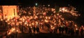 People with light and candles in the night. Royalty Free Stock Photo