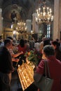 People light candles in Saint George church during a big holiday in Sofia, Bulgaria on may 6, 2012