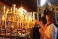 People light candles in Sveti Sedmochislenitsi Church during a big holiday in Sofia, Bulgaria on july 27, 2012