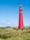 People and lighthouse North Tower in dunes of Frisian island Schiermonnikoog, Netherlands