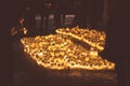 People lighting candles in the Kalevankangas cemetery in Tampere