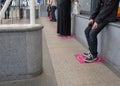 People in a line / queue at the bus station obeying a social distance rule during the quarantine or epidemic