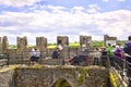 People lining up to kiss Blarney stone at Blarney castle Ireland Royalty Free Stock Photo