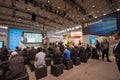 People listen presentation in booth of Microsoft company at CeBIT