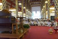 People listen to monk preachment in buddhism church temple