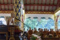 People listen to monk preachment in buddhism church temple