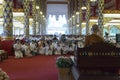 People listen to monk preachment in buddhism church temple