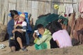 People of Lisu ethnic group sit in front of the house in Chiang Mai, Thailand.