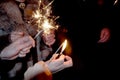 People lit the sparklers under the chiming clock for the new year