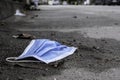 People littering of garbage of used health masks throw on the street , risk of disease