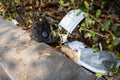 People littering of garbage of used medical masks throw in the crevices of the bushes,hazardous waste,risk of disease,spread of