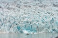 People in little inflatable rubber boat close to Vatnajokull glacier in Fjallsarlon glacier lagoon in Iceland.