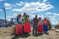 The people living on the reed island of Lake Titicaca are introducing themselves and tell tourists stories about how they making l