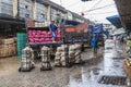 People load the trucks in rain