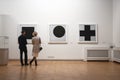 People look at Black Square painting, Kazimir Malevich arts on display at The State Russian Museum, St.Petersburg