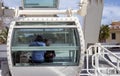 People look at the panorama of the Spanish city of Malaga from the Ferris Cabin