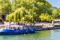 People look at work of French water policemen in a boat