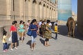 People looking at the camel in the city of Khiva in Uzbekistan.