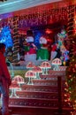 People looking at the Christmas decoration on the facade of a house in Villavicencio