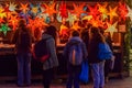 People looking at Christmas star decorations