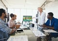 People looking at a computer with e-learning information in the screen Royalty Free Stock Photo