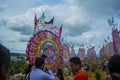 people looking at giant colorful kites with animal figures