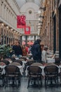 People looking at the menu of a restaurant inside Royal Gallery of Saint Hubert, Brussels, Belgium Royalty Free Stock Photo