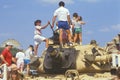 People Looking at Military Tank