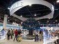 People looking at the Royole tree exhibit made out of flexible displays at CES