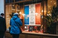 People looking at the window of Mariage Freres tea in Covent Garden, London, UK