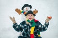 People Love winter. Winter woman. Greeting snowman. Joyful girl Having Fun with snowman in Winter Park. People in snow. Royalty Free Stock Photo