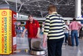 People at the luggage rack package at Vnukovo airport, Moscow, Russia