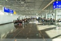 People with luggage sitting in waiting hall of airport Royalty Free Stock Photo