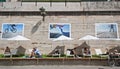 People lying in the sun on the banks of the seine in paris