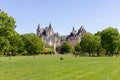 People in Majors Hill Park in spring. Fairmont Chateau Laurier Hotel building in city park in downtown Ottawa, Canada Royalty Free Stock Photo