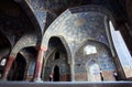 People make photos under the arches of old persian Imam Mosque in Iran