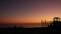 People making bbq campfire. Beachfront recreation area for barbeque with fire place. California USA