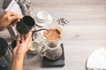 People making coffee for dripping hot coffee into the cup with equipment, tool brewing at kitchen home. Top view Royalty Free Stock Photo