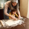 People making cookies from dough with dough mold