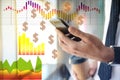 People making money. Closeup of businessman using smartphone surrounded by digital charts and dollar signs Royalty Free Stock Photo