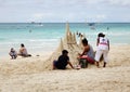 People making sand castles on the beach in Boracay, Philippines